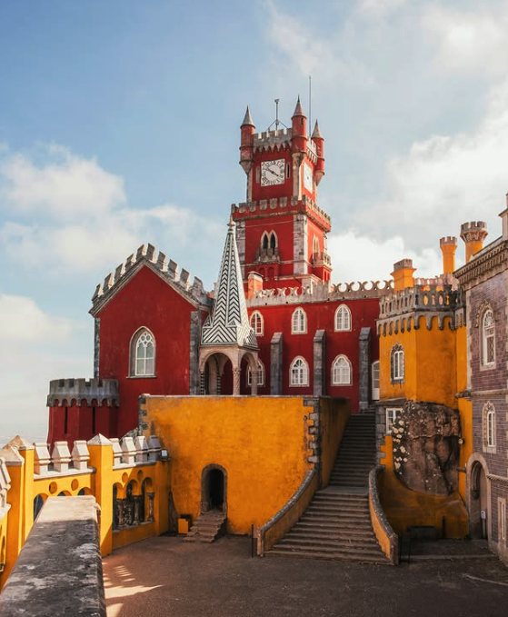Visitors on the terraces of Pena Palace above the Serra de Sintra