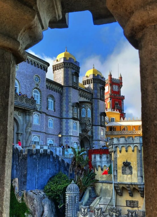 Visitors on the terraces of Pena Palace above the Serra de Sintra